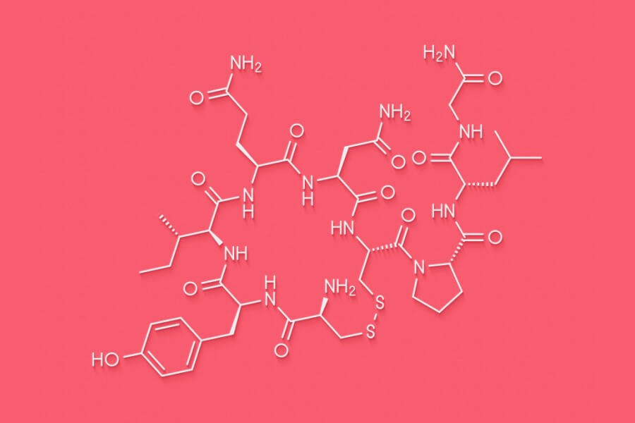 Wzór chemiczny oksytocyny na różowym tle.